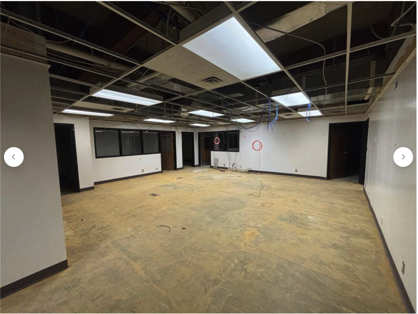 Interior renovation — open floor area, exposed ceiling
