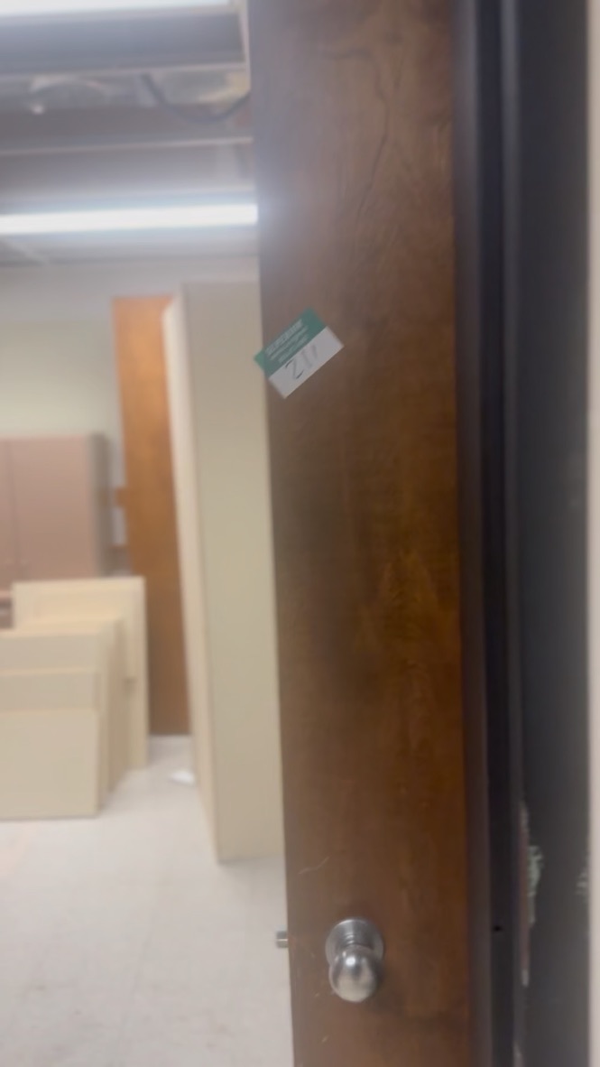 Room entrance — cubicle partitions visible