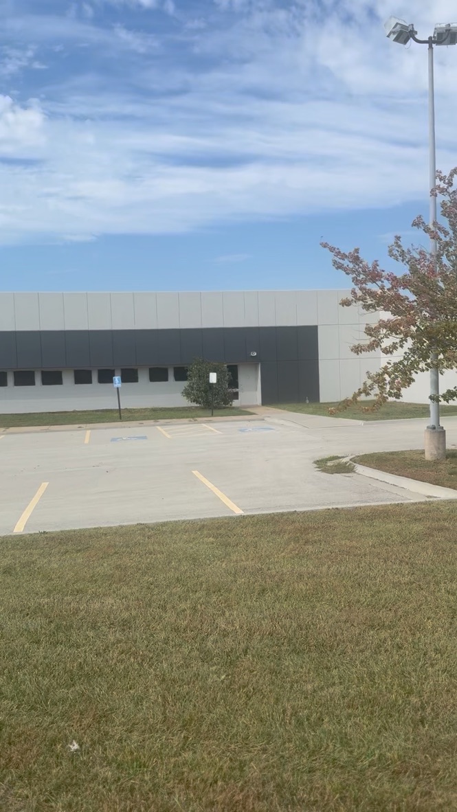 Parking lot and building entrance with handicap spaces