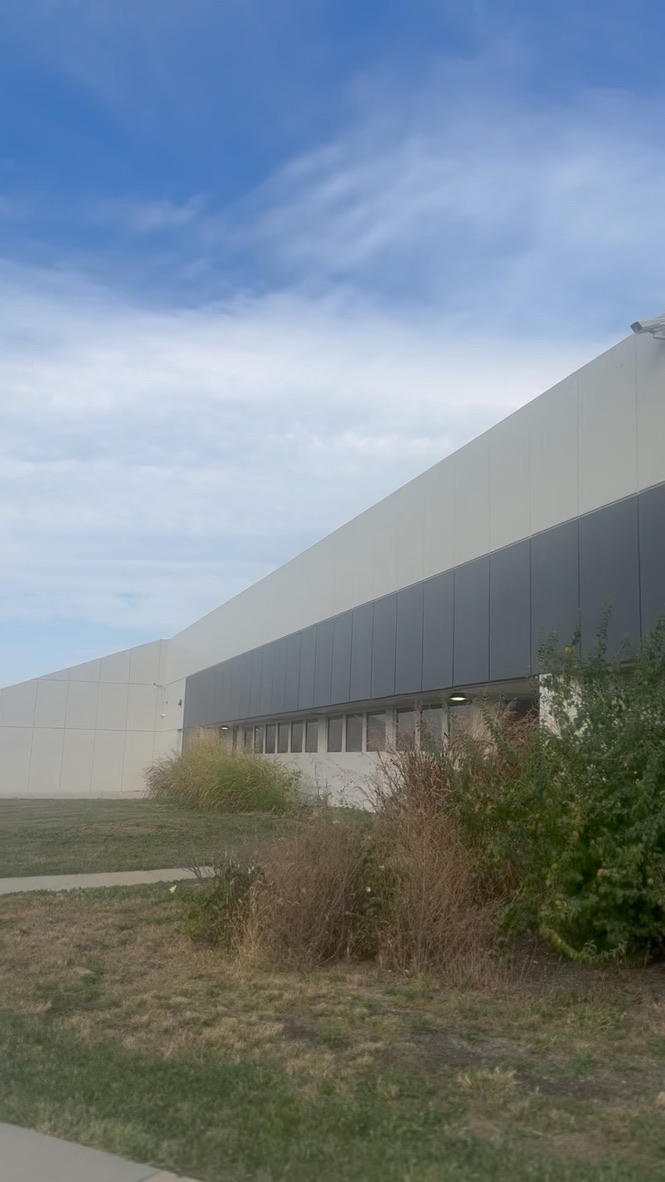 Building side facade — long view with window band