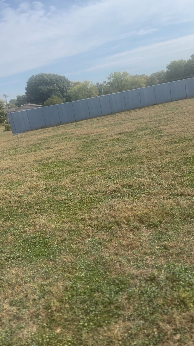 Fenced yard — metal privacy fence boundary